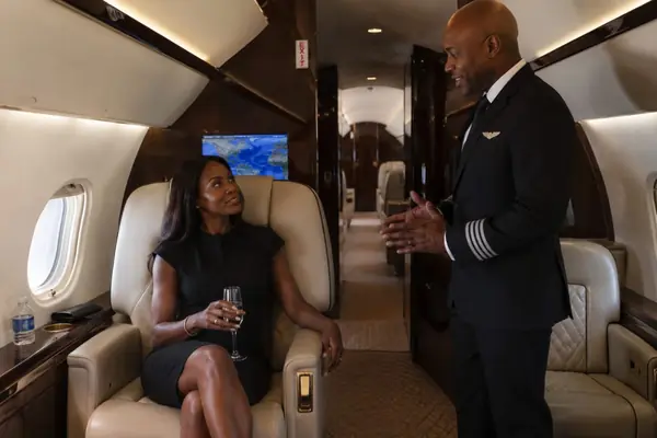 Private jet captain greeting passenger, Abuja Lagos charter